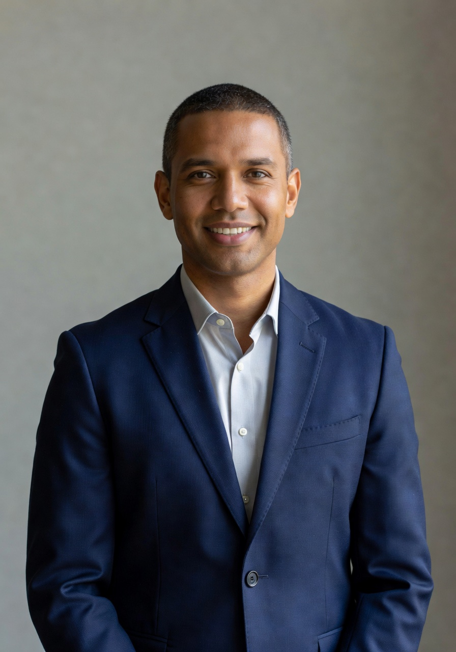 AI-generated LinkedIn headshot with navy blazer and neutral grey backdrop — SelfAI Studio